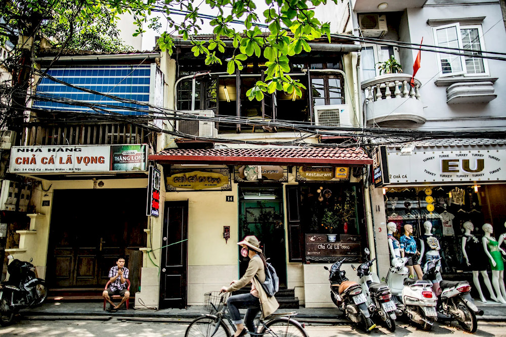 Cha Ca Street, nestled in Hanoi’s Old Quarter, is a narrow lane steeped in history, renowned as the birthplace of the iconic Cha Ca La Vong dish 